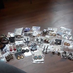36 pairs of earrings and a butterfly stretch ring